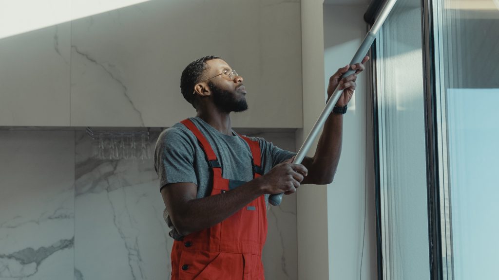man cleaning the window